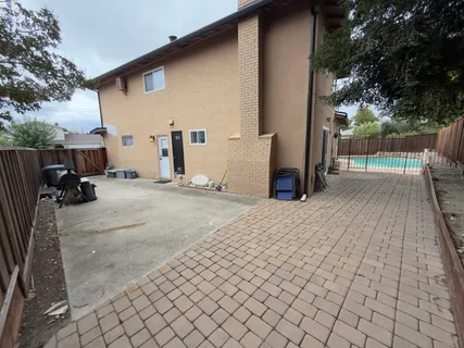 a view of a backyard of the house
