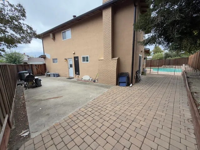a view of a backyard of the house