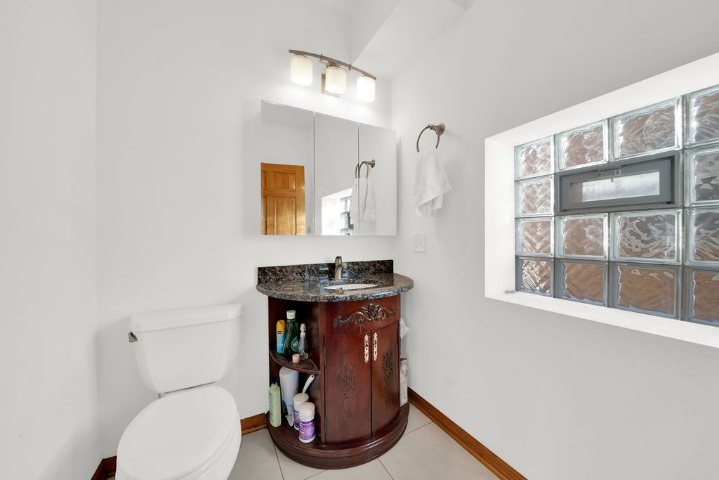 3917 West 60th Street Chicago, IL 60629 - Photo 11 of 34 a bathroom with a toilet and a sink
