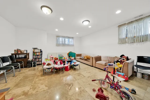 a living room with lots of furniture and toys