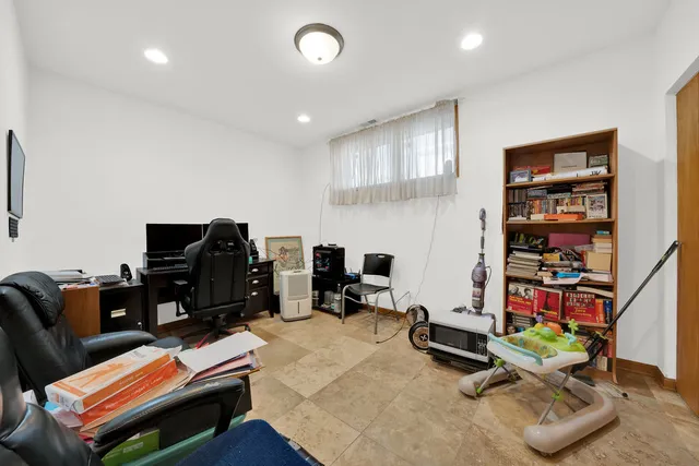 a room with furniture gym equipment and a flat screen tv