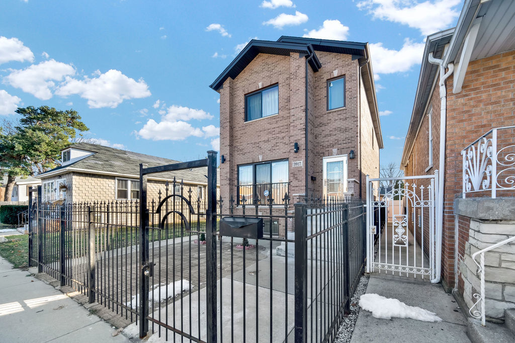 3917 West 60th Street Chicago, IL 60629 - Photo 33 of 34 a view of a house with iron fence