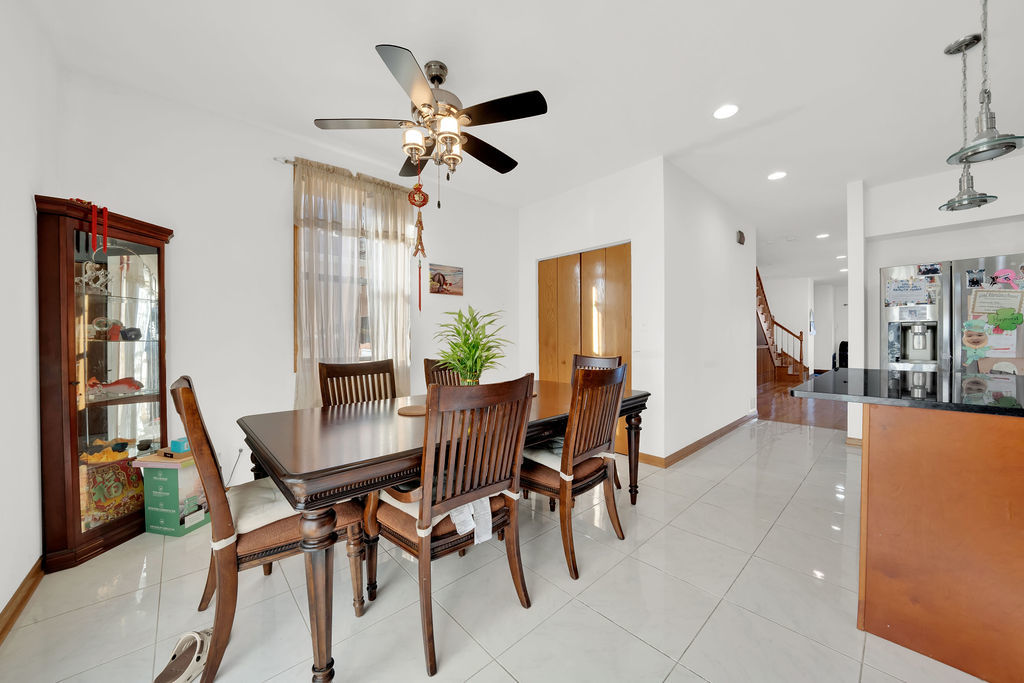 3917 West 60th Street Chicago, IL 60629 - Photo 8 of 34 a view of a dining room with furniture and a potted plant