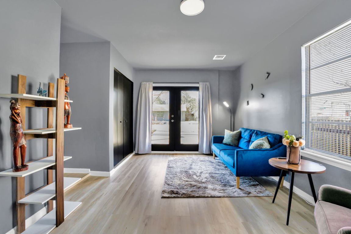 1205 Arthur Stiles Road Austin, TX 78721 - Photo 10 of 20 a living room with furniture and a book shelf