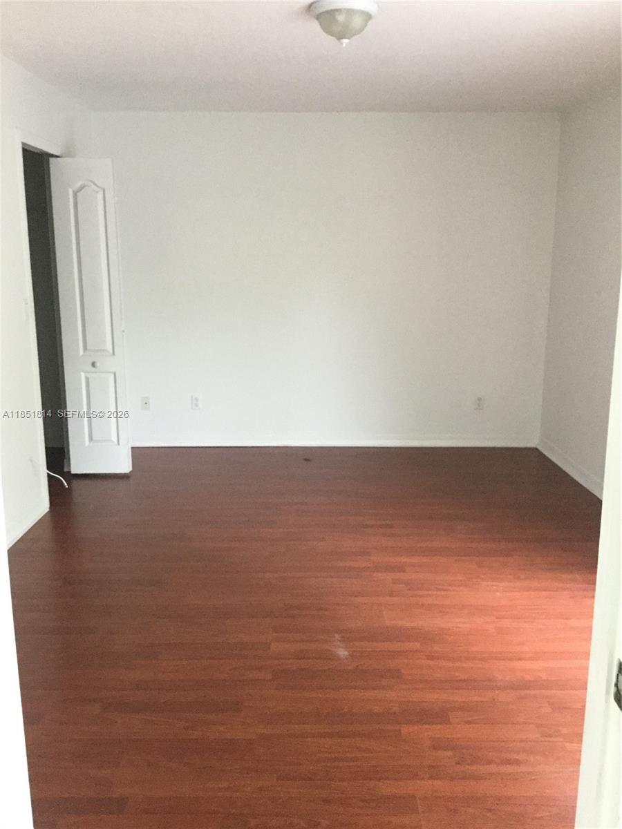 2885 Southwest 127th Avenue Miramar, FL 33027 - Photo 11 of 13 a view of room with window and wooden floor