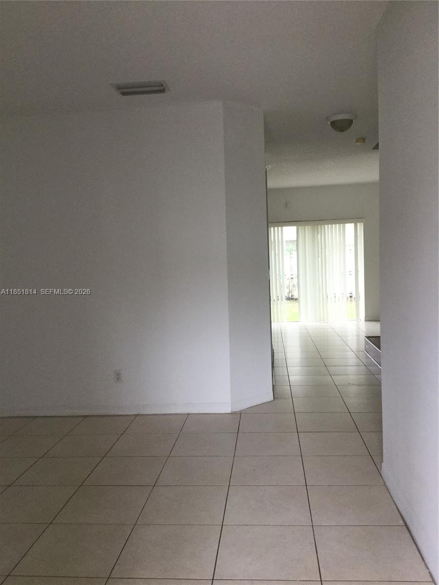 2885 Southwest 127th Avenue Miramar, FL 33027 - Photo 3 of 13 a view of an empty room and window