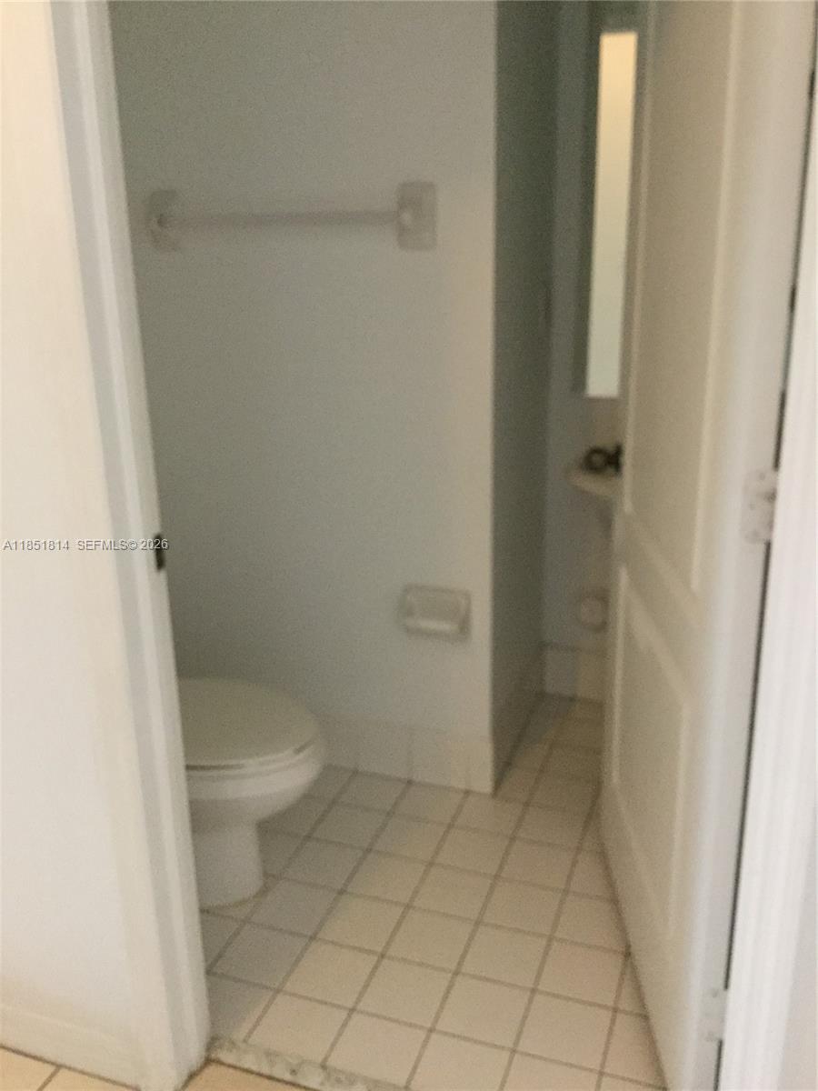 2885 Southwest 127th Avenue Miramar, FL 33027 - Photo 6 of 13 a bathroom with a toilet and a shower
