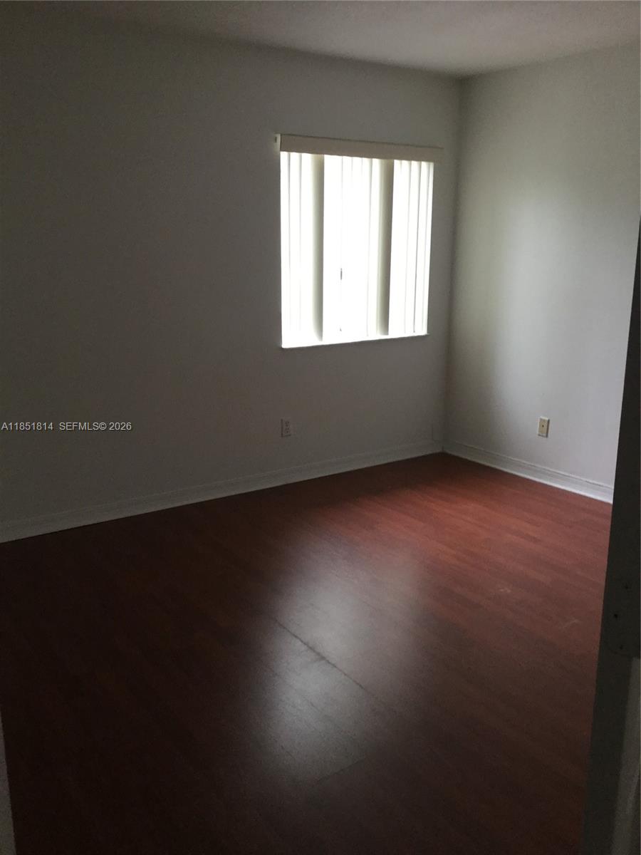 2885 Southwest 127th Avenue Miramar, FL 33027 - Photo 8 of 13 an empty room with a window