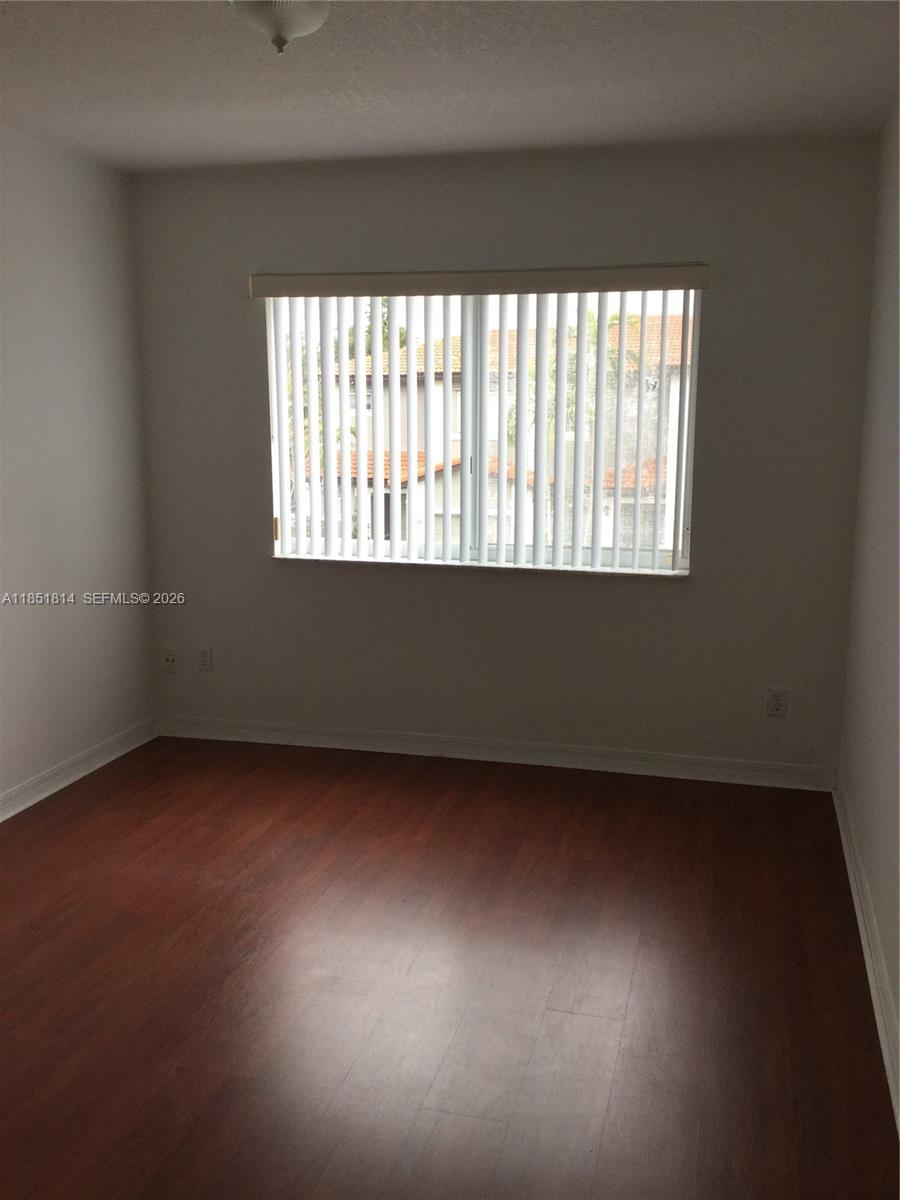 2885 Southwest 127th Avenue Miramar, FL 33027 - Photo 9 of 13 a view of an empty room with a window