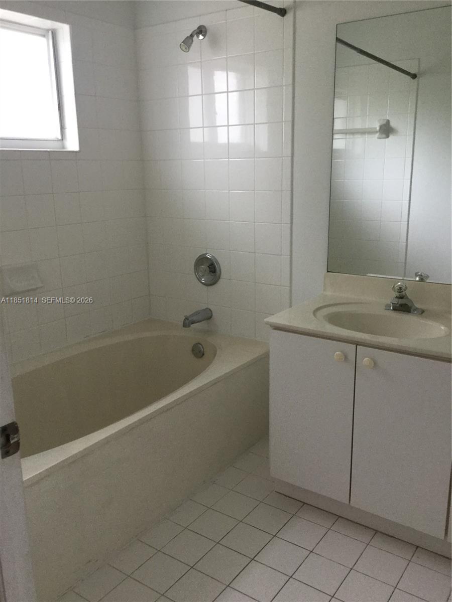 2885 Southwest 127th Avenue Miramar, FL 33027 - Photo 10 of 13 a bathroom with a sink a toilet and shower
