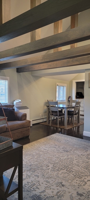 11 Walter Street, Unit 2 Boston, MA 02136 - Photo 2 of 26 a room with furniture and a flat screen tv