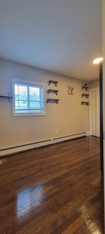 11 Walter Street, Unit 2 Boston, MA 02136 - Photo 22 of 26 an empty room with wooden floor and windows