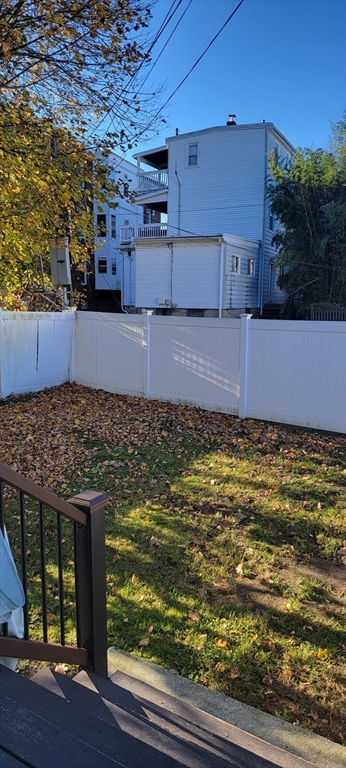 11 Walter Street, Unit 2 Boston, MA 02136 - Photo 24 of 26 a view of a swimming pool next to a yard