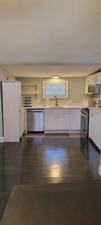 11 Walter Street, Unit 2 Boston, MA 02136 - Photo 3 of 26 a view of kitchen and empty room with wooden floor