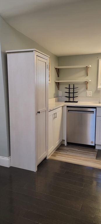 11 Walter Street, Unit 2 Boston, MA 02136 - Photo 6 of 26 a kitchen with stainless steel appliances granite countertop a refrigerator a sink a stove and white cabinets