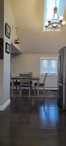 a view of dining room with furniture and wooden floor