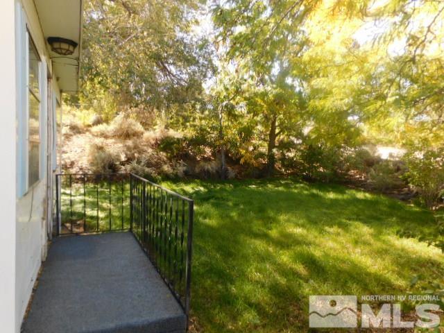 4880 Wayne Drive Sun Valley, NV 89433 - Photo 3 of 11 a view of a pathway of a garden