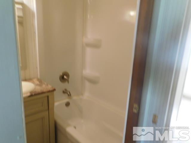4880 Wayne Drive Sun Valley, NV 89433 - Photo 9 of 11 a bathroom with a bathtub