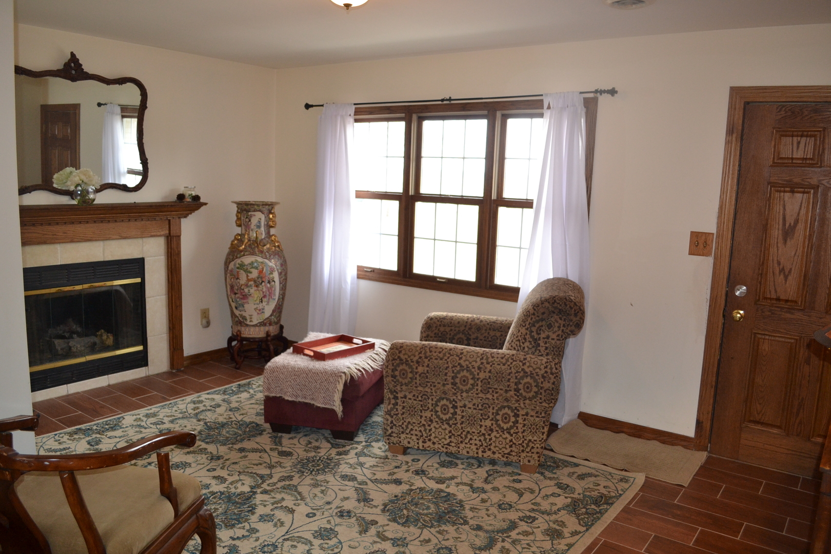 31446 South Kavanaugh Road Wilmington, IL 60481 - Photo 6 of 19 a living room with furniture a fireplace and a window
