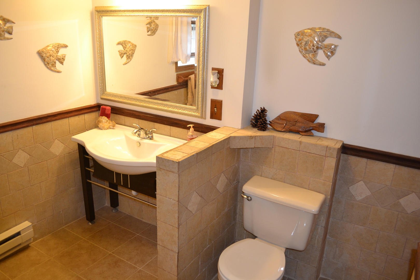 31446 South Kavanaugh Road Wilmington, IL 60481 - Photo 7 of 19 a bathroom with a toilet a sink and mirror