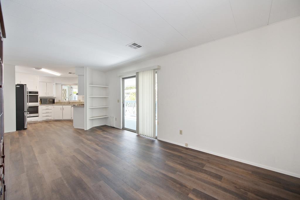 163 Rimma Way Roseville, CA 95661 - Photo 16 of 35 a view of a kitchen with wooden floor and electronic appliances