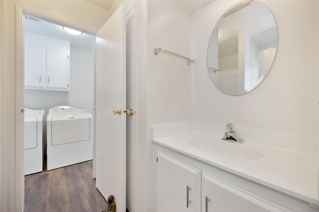 163 Rimma Way Roseville, CA 95661 - Photo 19 of 35 a bathroom with a sink and a mirror