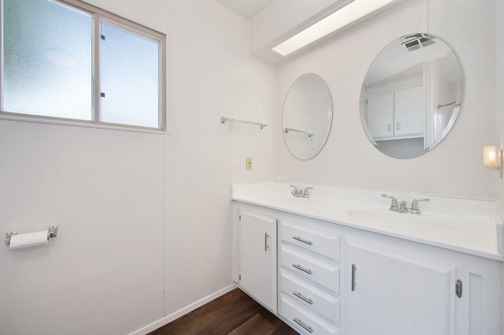 163 Rimma Way Roseville, CA 95661 - Photo 23 of 35 a bathroom with a double vanity sink and a mirror
