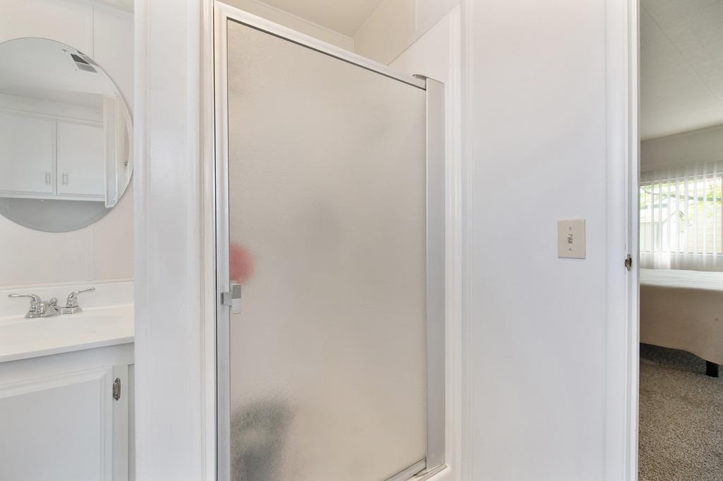 163 Rimma Way Roseville, CA 95661 - Photo 24 of 35 a bathroom with a shower and a sink