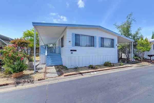 a view of a backyard of the house