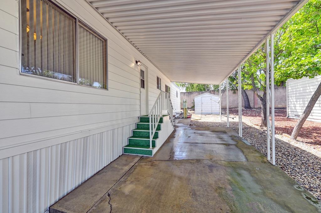 163 Rimma Way Roseville, CA 95661 - Photo 32 of 35 a view of a house with backyard and sitting area