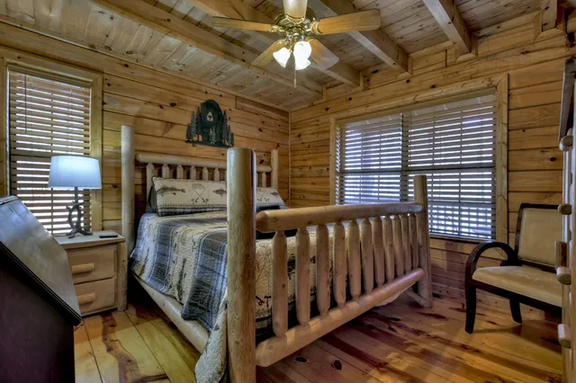 a bathroom with a granite countertop toilet sink and mirror