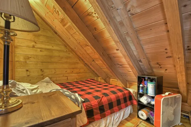 a backyard of a house with barbeque oven and outdoor seating