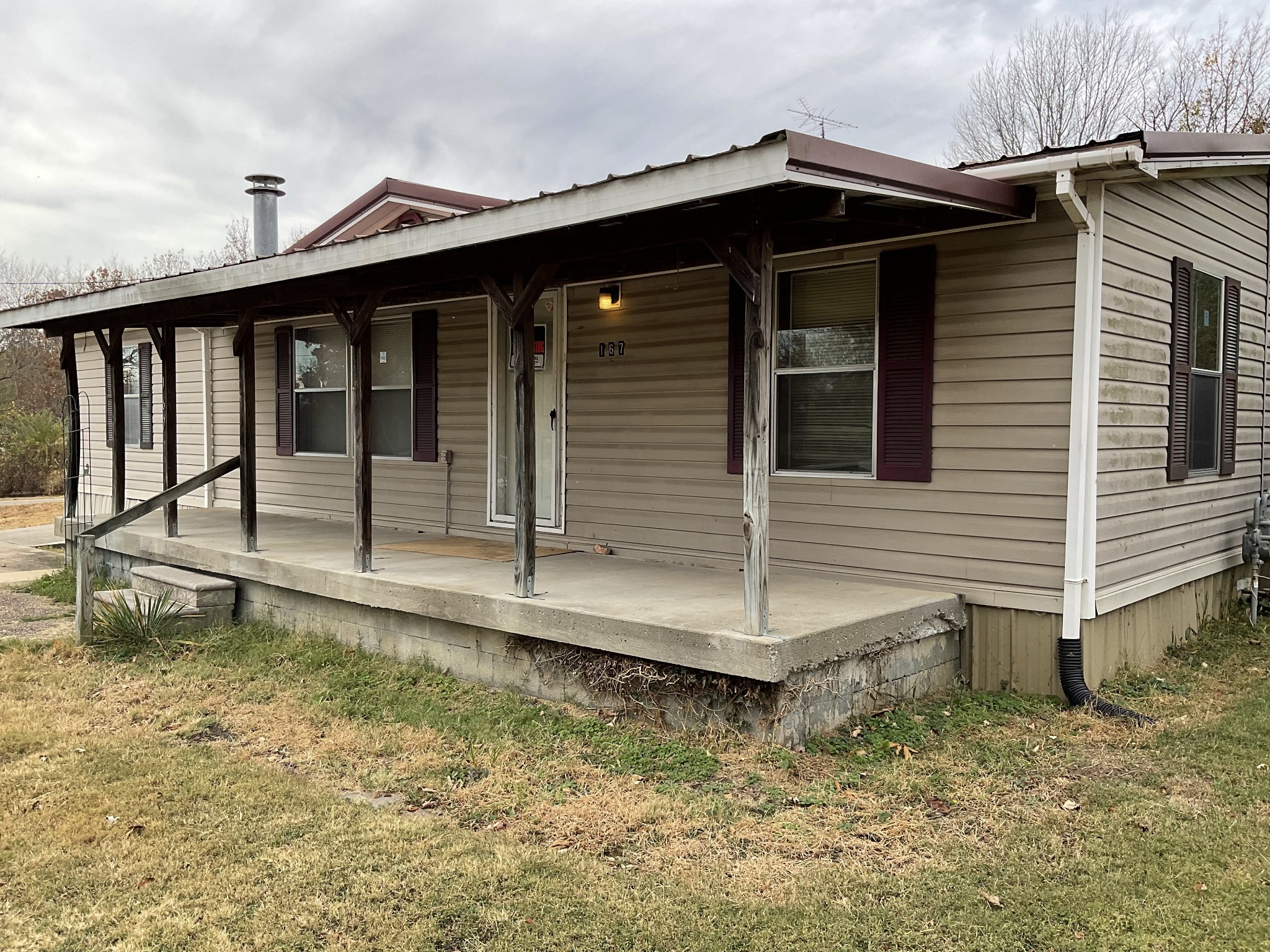 167 Dripping Springs Street Crofton, KY 42217 - Photo 20 of 30 a view of a house with a wooden deck