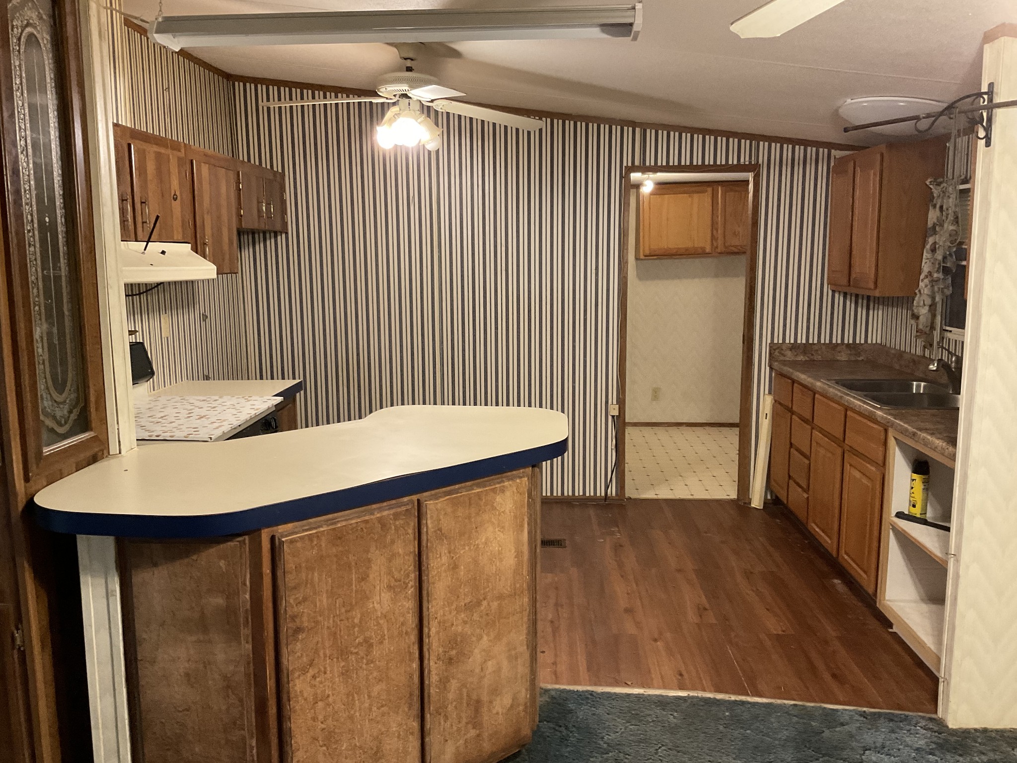 167 Dripping Springs Street Crofton, KY 42217 - Photo 10 of 30 a view of kitchen with furniture and wooden floor