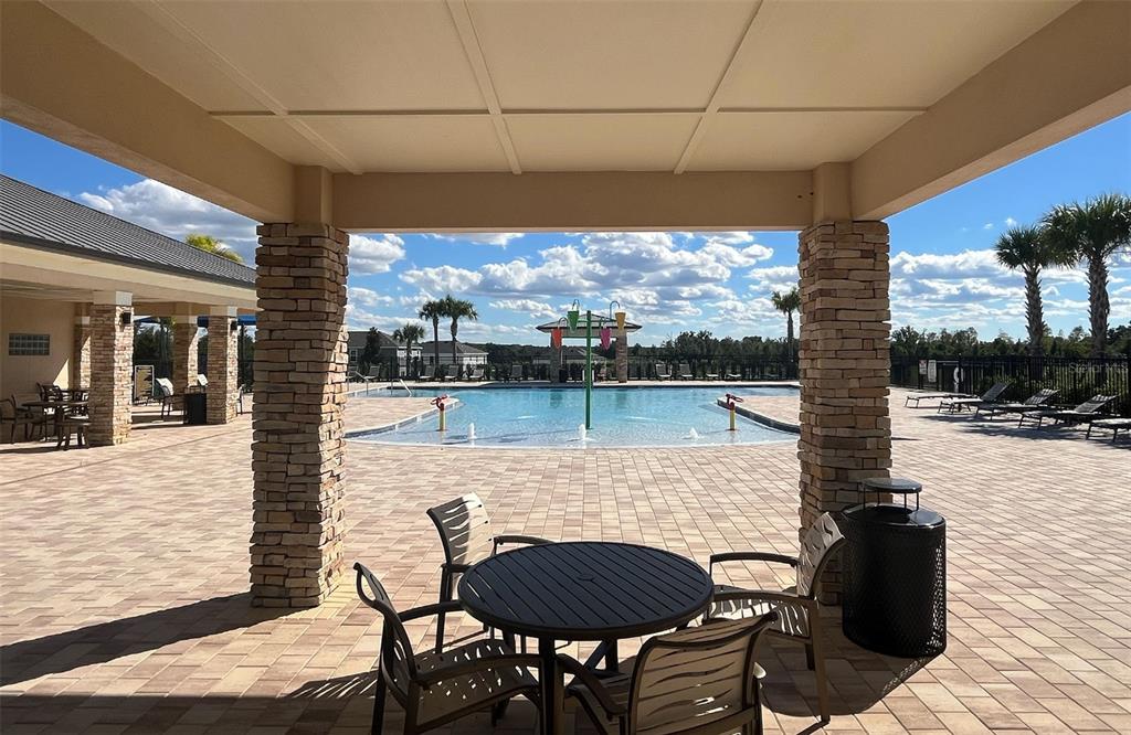 6757 Broad Wing Loop Howey-in-the-Hills, FL 34737 - Photo 6 of 8 a view of a terrace with furniture
