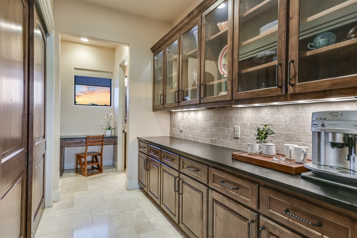 17017 South Ridge Lane Austin, TX 78734 - Photo 16 of 28 a kitchen with stainless steel appliances granite countertop a sink and cabinets