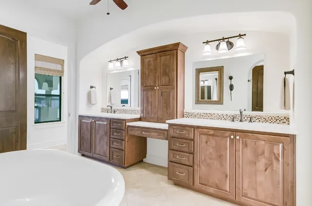 a bathroom with a shower sink and mirror