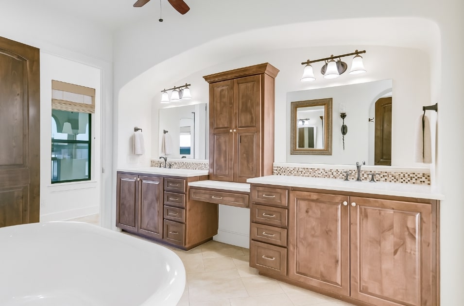 17017 South Ridge Lane Austin, TX 78734 - Photo 19 of 28 a spacious bathroom with a granite countertop sink a mirror and a bathtub