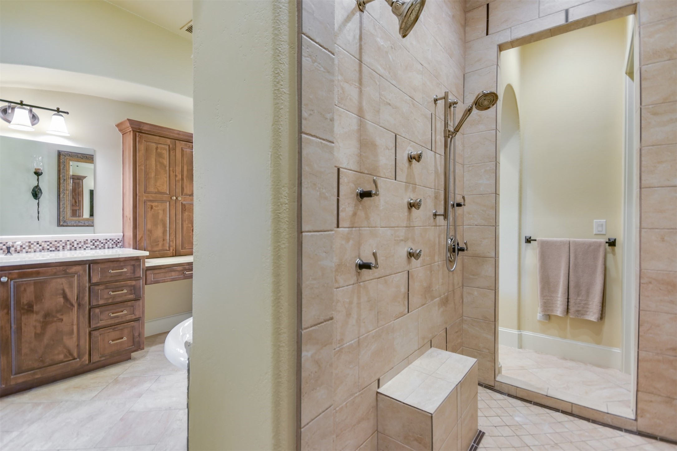 17017 South Ridge Lane Austin, TX 78734 - Photo 20 of 28 a bathroom with a shower sink and mirror