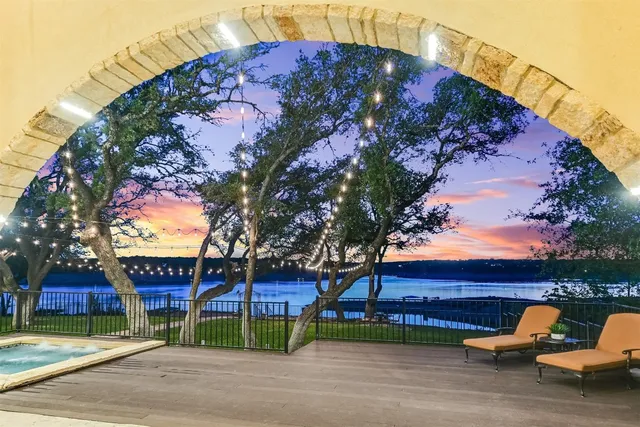 a view of a house with a yard and sitting area