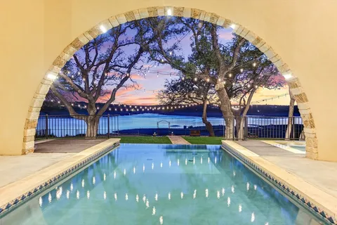 a view of swimming pool with a patio