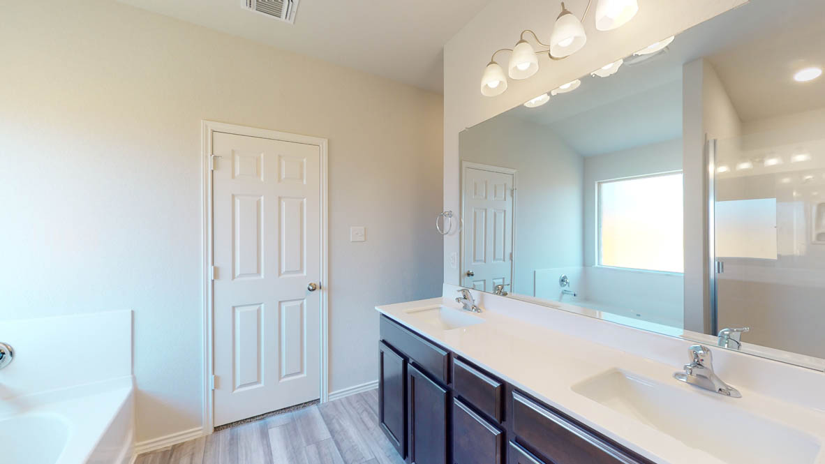 246 Water Wl Road Burnet, TX 78611 - Photo 9 of 16 a bathroom with a sink vanity and a mirror