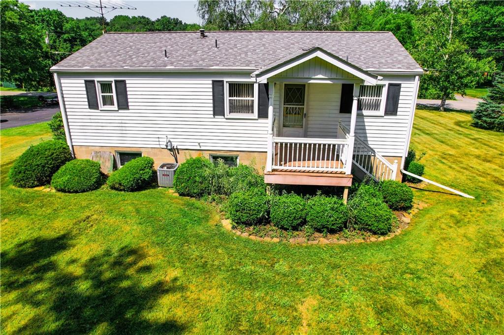 130 Country Club Road Butler, PA 16002 - Photo 4 of 38 a front view of a house with a yard and garage