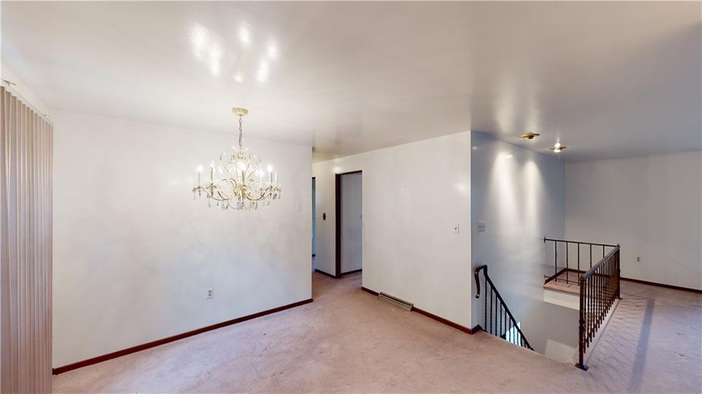 130 Country Club Road Butler, PA 16002 - Photo 9 of 38 an empty room with chandelier fan and windows