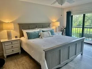 a bedroom with a bed and a large window