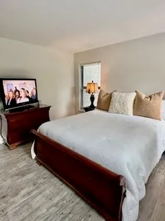 a bedroom with a bed and window