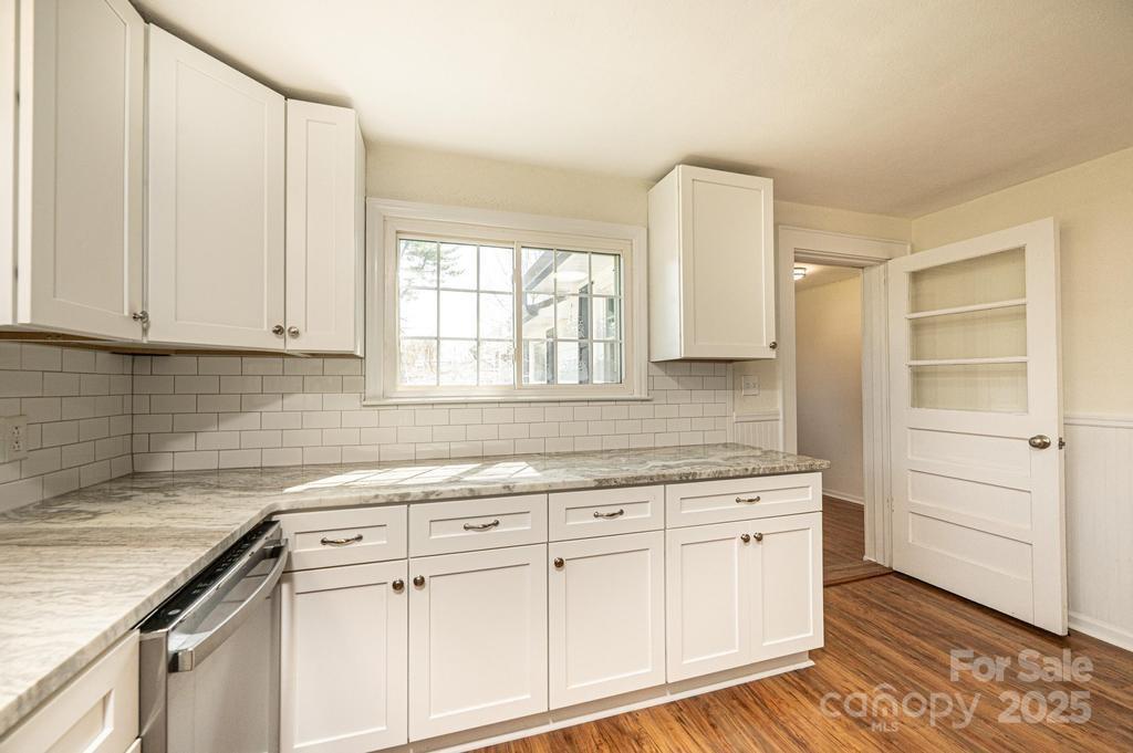 1993 Moss Farm Road Hickory, NC 28602 - Photo 21 of 41 a kitchen with white cabinets and sink