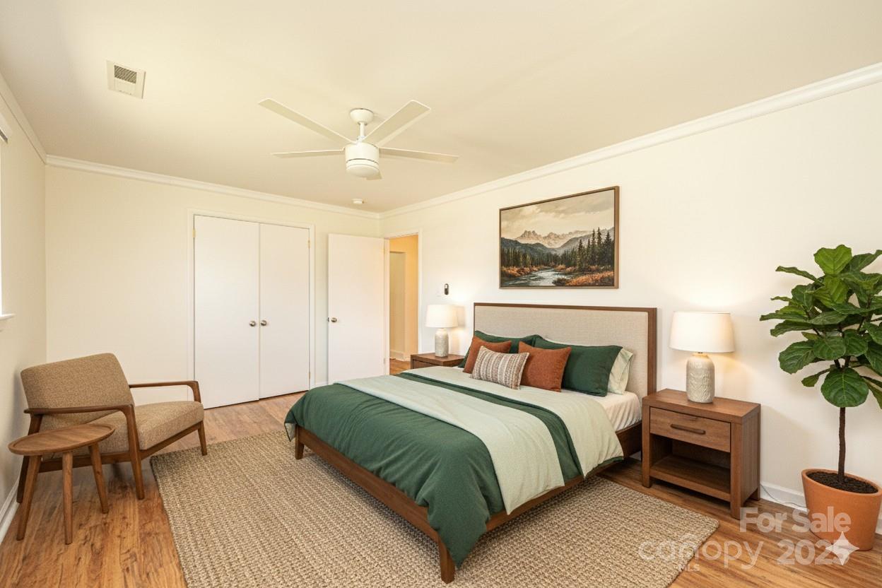 1993 Moss Farm Road Hickory, NC 28602 - Photo 25 of 41 a bedroom with a bed and a potted plant