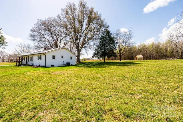a view of a swimming pool with an outdoor space and seating area