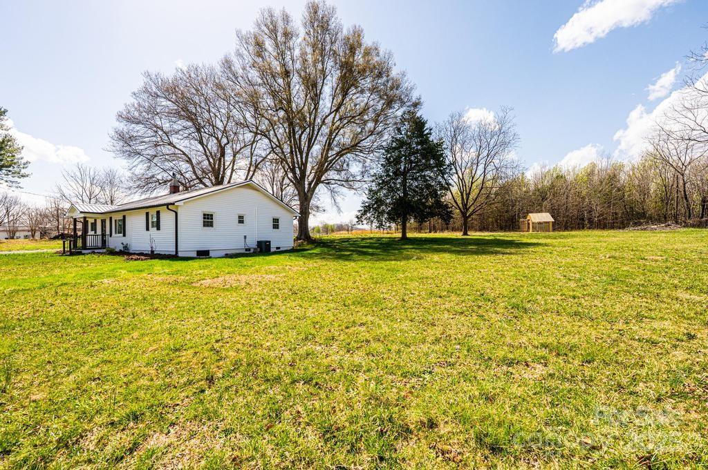 1993 Moss Farm Road Hickory, NC 28602 - Photo 6 of 41 a view of a swimming pool with an outdoor space and seating area